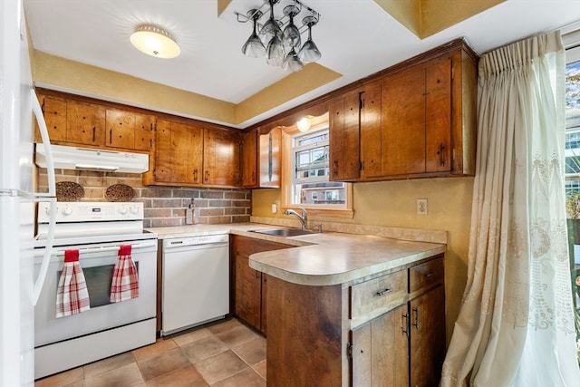 kitchen with backsplash, sink, light tile patterned floors, and white appliances