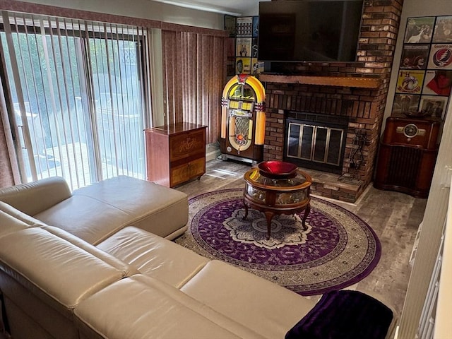 20 Meadowbrook Ln Unit 20, Palmer, MA 01069 - living area featuring plenty of natural light, a brick fireplace, and wood finished floors