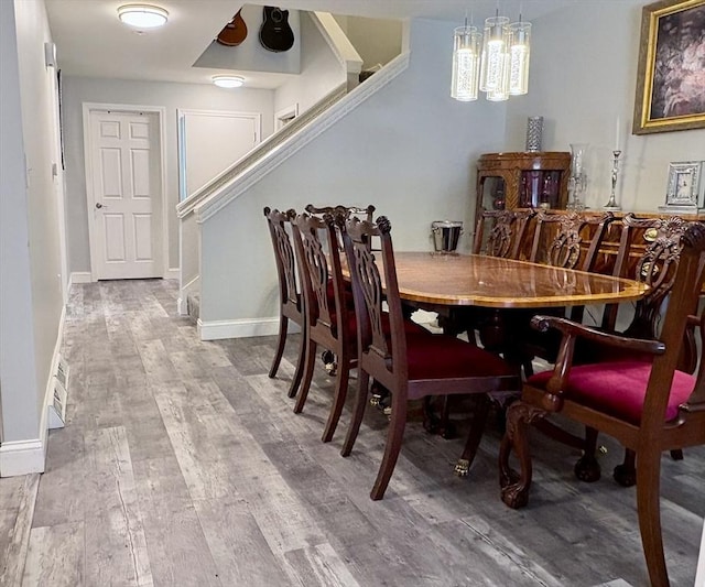 20 Meadowbrook Ln Unit 20, Palmer, MA 01069 - dining area featuring wood finished floors, stairs, and a chandelier