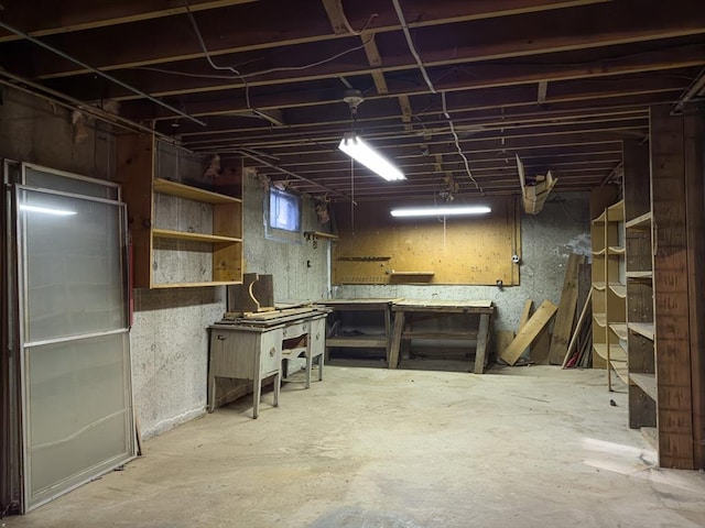 basement with a workshop area