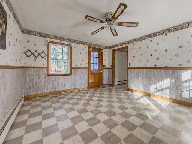 unfurnished room with a baseboard radiator and ceiling fan