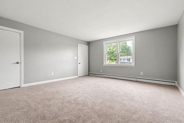 429 Mechanic St, Leominster, MA 01453 - empty room featuring a baseboard heating unit and carpet flooring