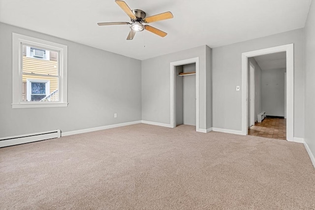 429 Mechanic St, Leominster, MA 01453 - unfurnished bedroom with light colored carpet, a closet, a ceiling fan, a baseboard heating unit, and baseboard heating
