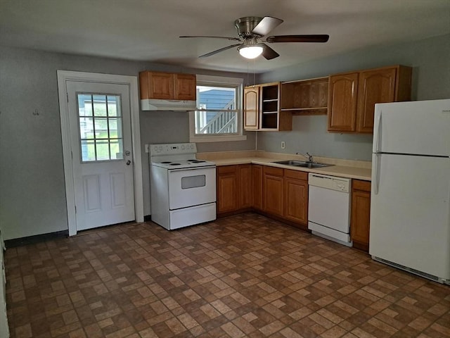 429 Mechanic St, Leominster, MA 01453 - kitchen with white appliances, under cabinet range hood, brick patterned flooring, and light countertops