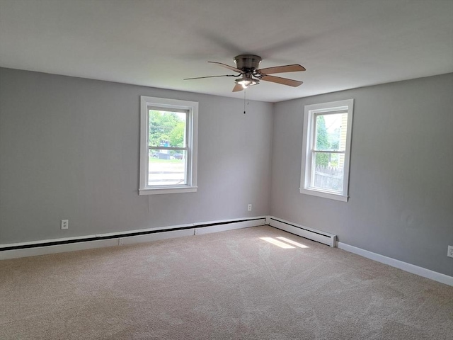 429 Mechanic St, Leominster, MA 01453 - carpeted spare room featuring plenty of natural light, a ceiling fan, and a baseboard heating unit