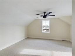 bonus room with ceiling fan and lofted ceiling