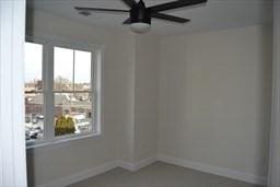 unfurnished room featuring ceiling fan