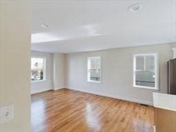 unfurnished living room featuring light wood-type flooring