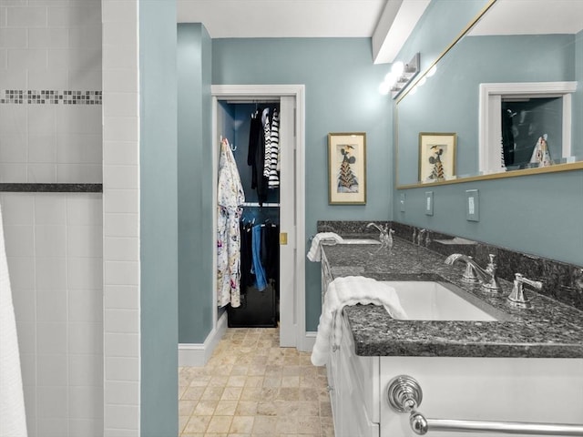 71 Nourse St, Westborough, MA 01581 - bathroom featuring double vanity and stone finish floors