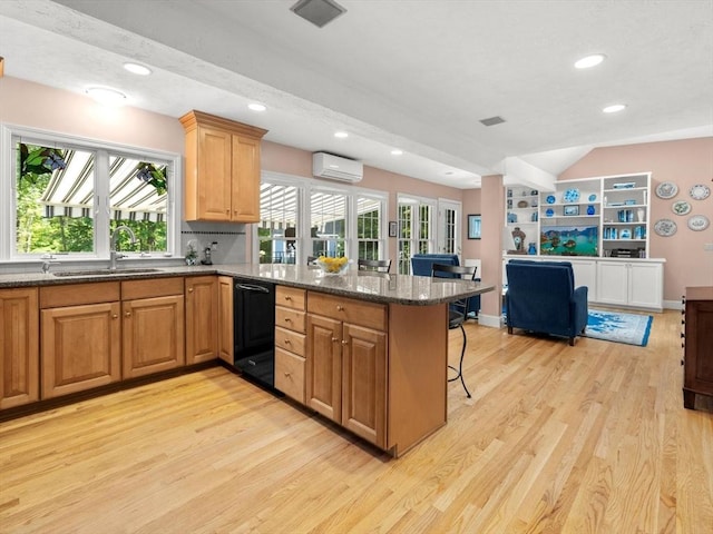 71 Nourse St, Westborough, MA 01581 - kitchen featuring dishwasher, light wood-style floors, a peninsula, a breakfast bar, and recessed lighting