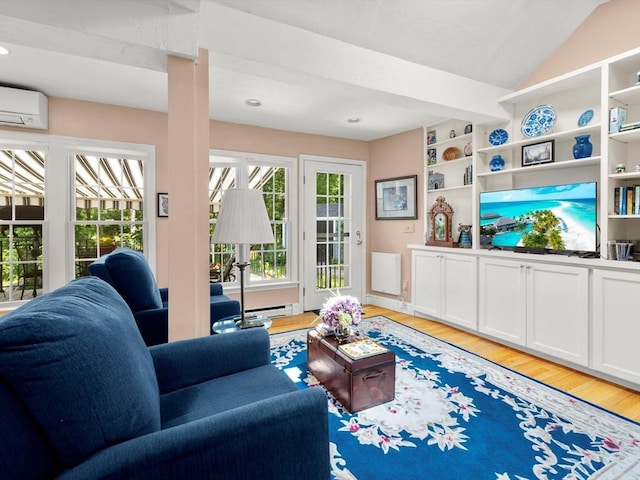 71 Nourse St, Westborough, MA 01581 - living area featuring a wall mounted air conditioner, light wood finished floors, baseboard heating, and vaulted ceiling