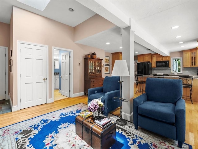 71 Nourse St, Westborough, MA 01581 - living room with light wood finished floors, recessed lighting, and a skylight