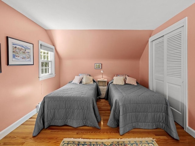 71 Nourse St, Westborough, MA 01581 - bedroom featuring lofted ceiling, a closet, and light wood-style flooring