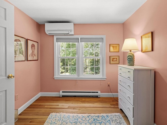 71 Nourse St, Westborough, MA 01581 - sitting room with a wall mounted air conditioner, a baseboard radiator, and light wood-style floors