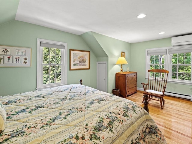 71 Nourse St, Westborough, MA 01581 - bedroom featuring a wall mounted air conditioner, multiple windows, wood finished floors, vaulted ceiling, and baseboard heating