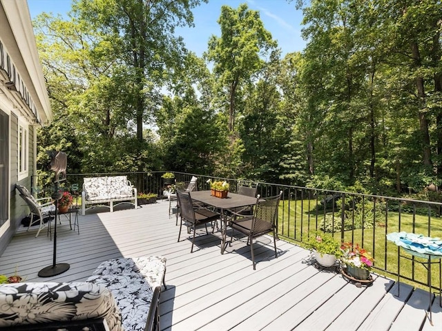71 Nourse St, Westborough, MA 01581 - wooden deck with outdoor dining area and a lawn