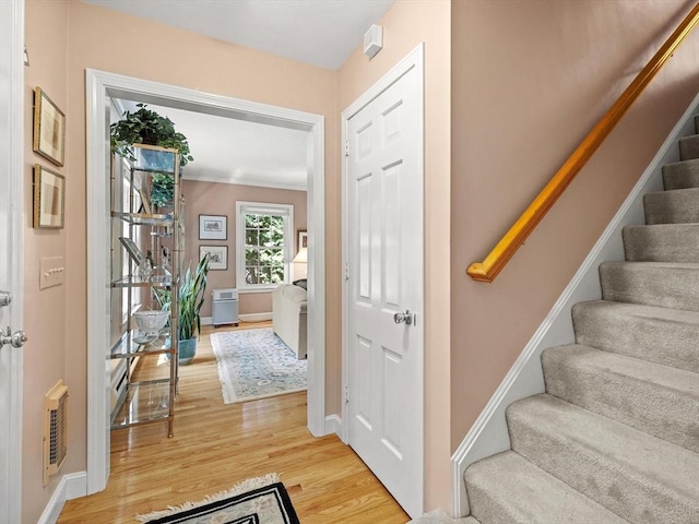71 Nourse St, Westborough, MA 01581 - entryway with light wood finished floors and stairway