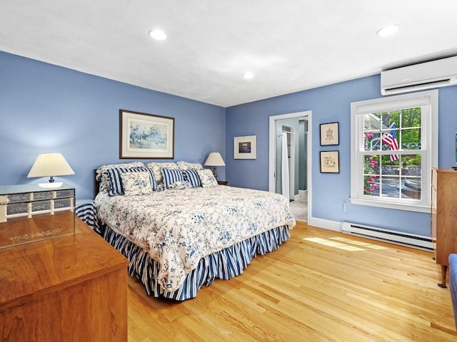 71 Nourse St, Westborough, MA 01581 - bedroom featuring a baseboard heating unit, wood finished floors, an AC wall unit, and recessed lighting