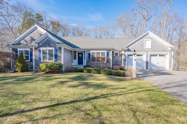 ranch-style home with a front yard and a garage