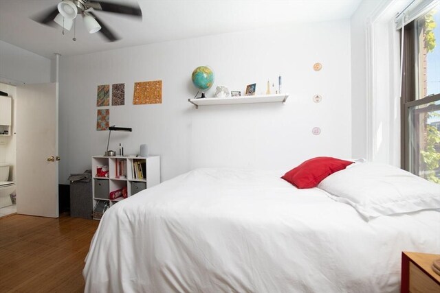 bedroom featuring wood finished floors and ceiling fan