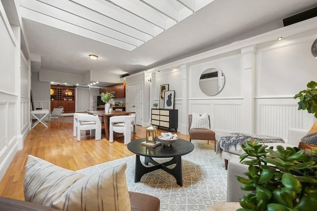 515 Franklin St Unit 4, Cambridge, MA 02139 - living room featuring a decorative wall and light wood-style floors