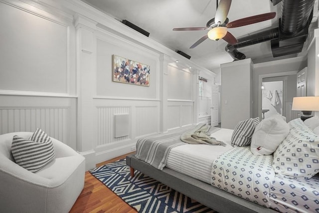515 Franklin St Unit 4, Cambridge, MA 02139 - bedroom featuring wood finished floors, a decorative wall, a ceiling fan, and ensuite bath