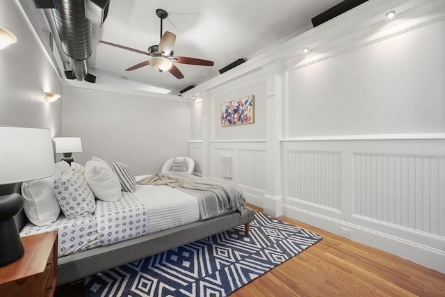 515 Franklin St Unit 4, Cambridge, MA 02139 - bedroom with wood finished floors, a decorative wall, and ceiling fan