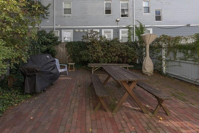 515 Franklin St Unit 4, Cambridge, MA 02139 - fenced backyard featuring a grill and a patio