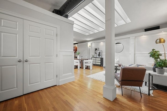 515 Franklin St Unit 4, Cambridge, MA 02139 - interior space featuring light wood-style flooring, a decorative wall, and decorative columns
