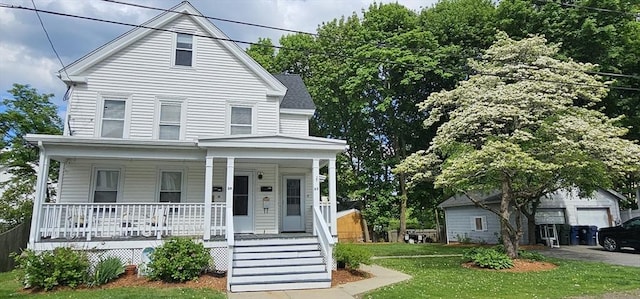 39 Franklin St, Marlborough, MA 01752 - view of front of home with covered porch and a front lawn