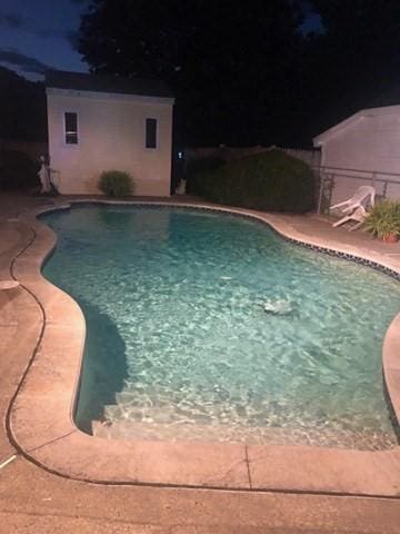 pool with a patio area