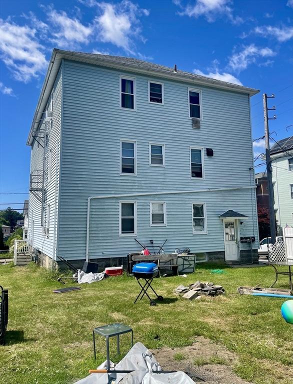 466-470 Cambridge St, Fall River, MA 02721 - rear view of property featuring a yard