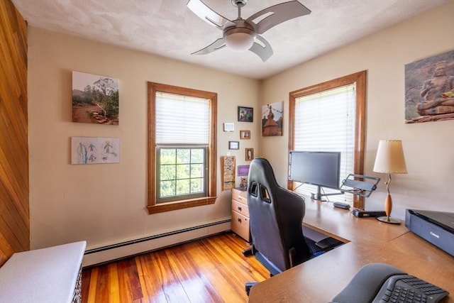 4 Fall St, Malden, MA 02148 - office with a baseboard heating unit, ceiling fan, and light wood-type flooring