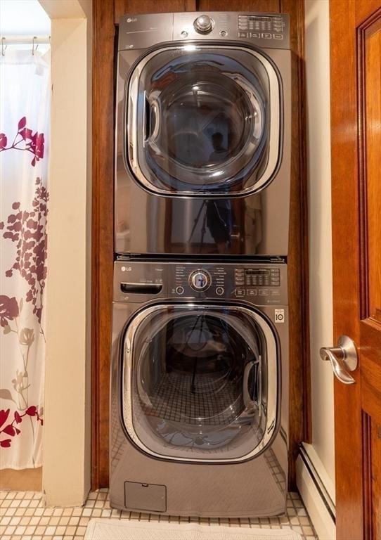 4 Fall St, Malden, MA 02148 - washroom featuring estacked washer and dryer and a baseboard radiator
