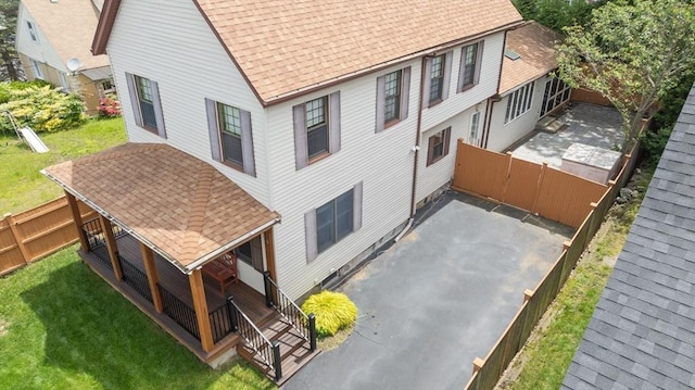 4 Fall St, Malden, MA 02148 - rear view of property featuring a shingled roof and a patio area