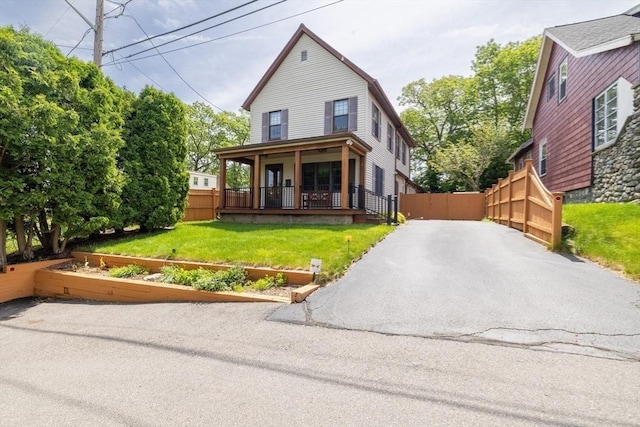 4 Fall St, Malden, MA 02148 - view of front of property featuring covered porch and a vegetable garden