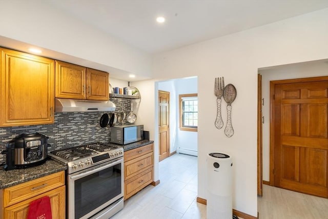 4 Fall St, Malden, MA 02148 - kitchen with stainless steel appliances, under cabinet range hood, baseboard heating, tasteful backsplash, and brown cabinetry
