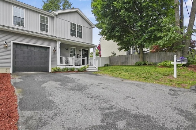 116 Pilgrim Rd Unit 116, Haverhill, MA 01832 - view of front of home featuring a porch, board and batten siding, an attached garage, and driveway