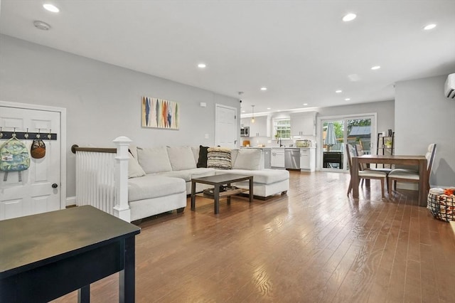 116 Pilgrim Rd Unit 116, Haverhill, MA 01832 - living area featuring wood-type flooring, recessed lighting, and a wall mounted AC
