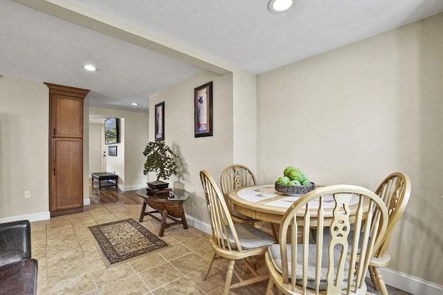 dining space with recessed lighting and baseboards