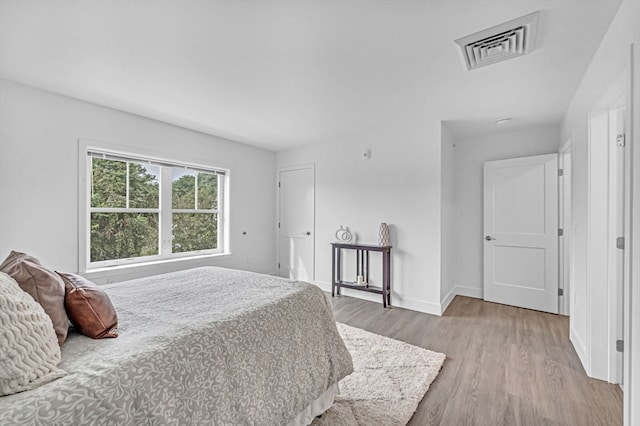 bedroom with light hardwood / wood-style floors