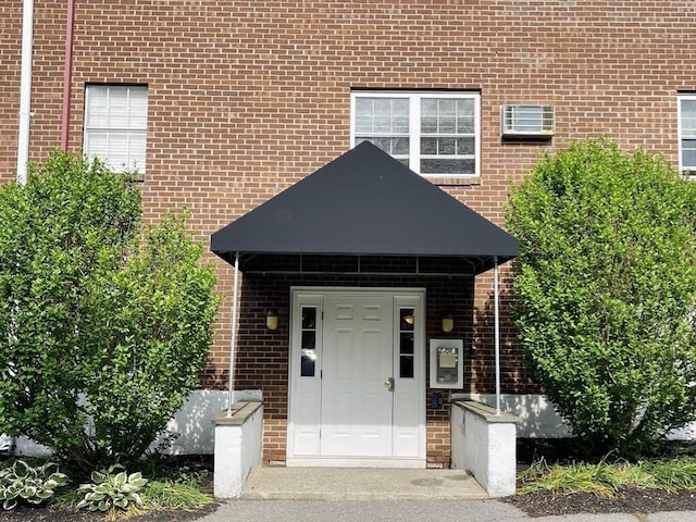 187 Great Rd Unit B2, Acton, MA 01720 - doorway to property with brick siding