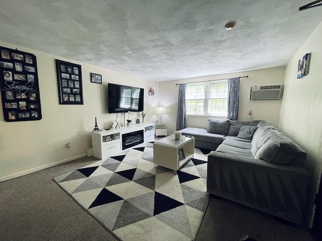 187 Great Rd Unit B2, Acton, MA 01720 - living room with a wall unit AC, a textured ceiling, carpet floors, and baseboards