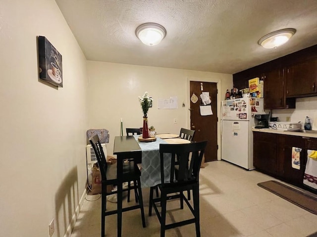 187 Great Rd Unit B2, Acton, MA 01720 - dining area featuring a textured ceiling and light flooring