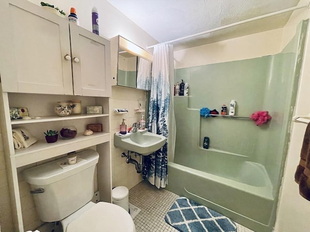 187 Great Rd Unit B2, Acton, MA 01720 - bathroom featuring shower / tub combo with curtain, toilet, a sink, and tile patterned flooring