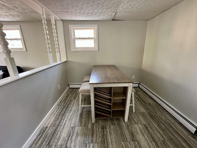203 Division St, Fall River, MA 02721 - unfurnished office featuring baseboard heating, wood finished floors, baseboards, and healthy amount of natural light