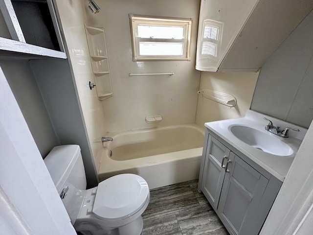 203 Division St, Fall River, MA 02721 - bathroom with toilet, vanity, shower / washtub combination, and wood finished floors