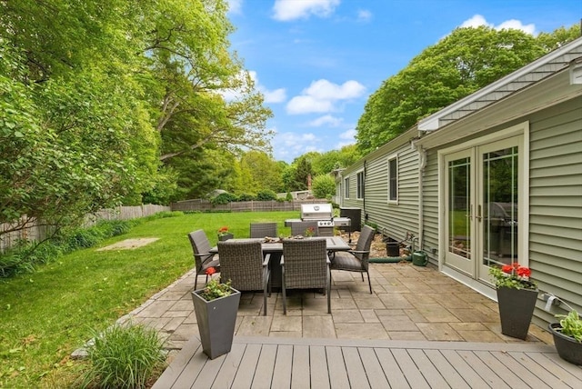 29 Day Ave, Hamilton, MA 01982 - wooden deck featuring outdoor dining space, grilling area, and a patio area
