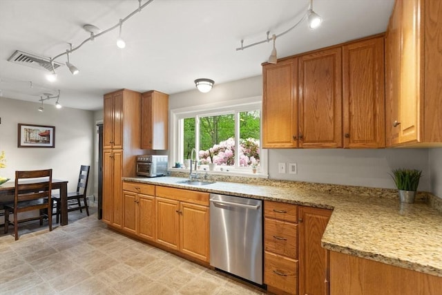 29 Day Ave, Hamilton, MA 01982 - kitchen featuring dishwasher, track lighting, a sink, and brown cabinetry
