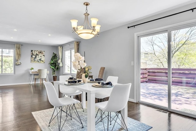 dining area featuring baseboards, plenty of natural light, dark wood-style floors, and visible vents